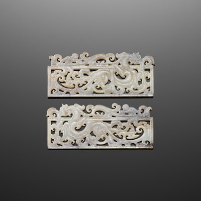 A RARE PAIR OF JADE OPENWORK ‘DRAGON AND IMMORTAL’ PLAQUES, HAN DYNASTY