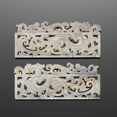 A RARE PAIR OF JADE OPENWORK ‘DRAGON AND IMMORTAL’ PLAQUES, HAN DYNASTY