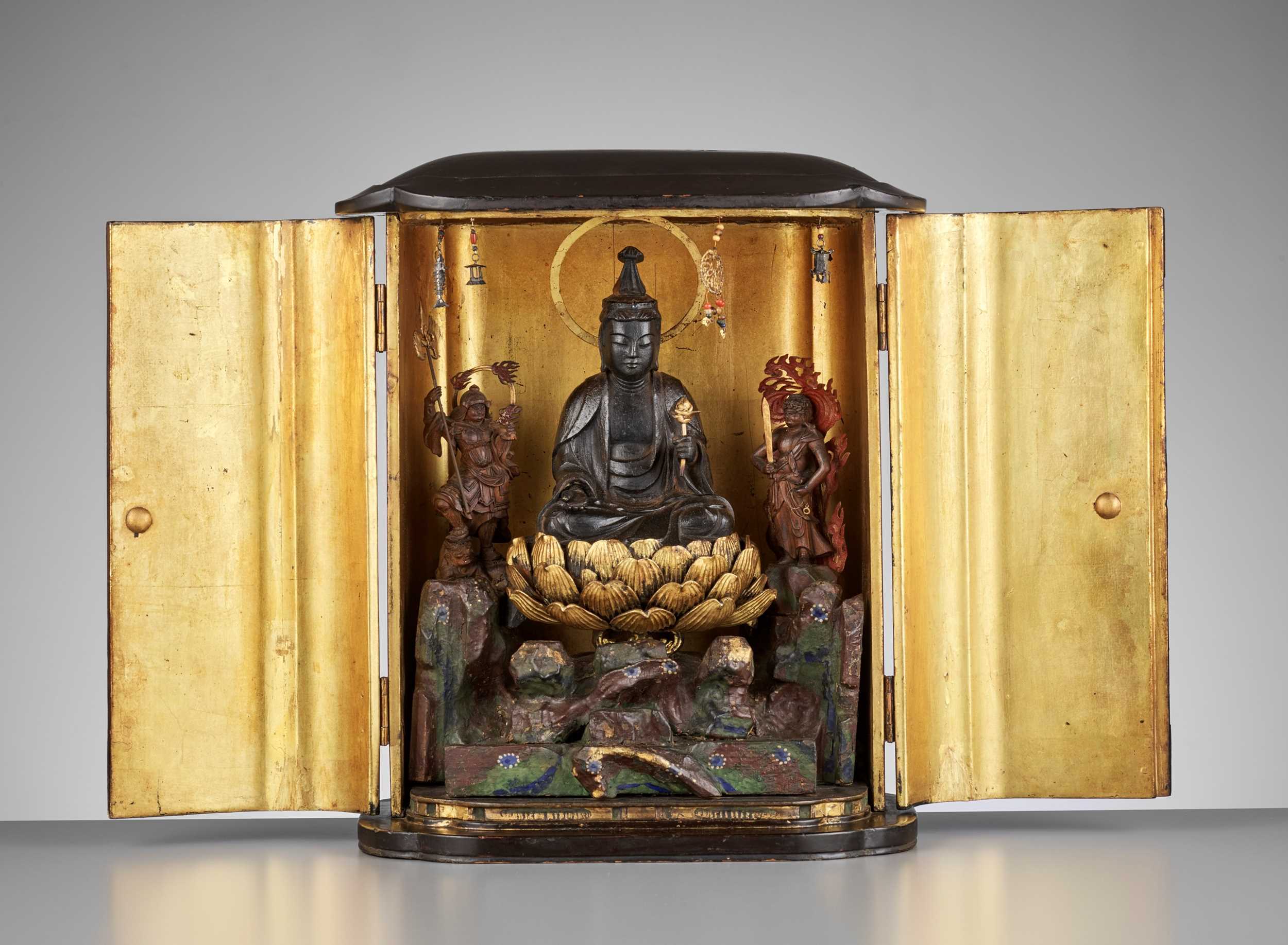 Lot 91 - A LARGE BLACK AND GOLD LACQUERED SHRINE (ZUSHI) WITH KANNON, BISHAMONTEN AND FUDO MYO-O