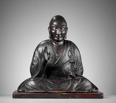 A LACQUERED WOOD FIGURE OF A SEATED BUDDHIST MONK