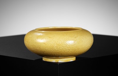 Lot 509 - AN INCISED YELLOW-GLAZED ‘PHOENIX’ BRUSHWASHER, EARLY QING DYNASTY