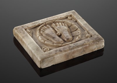 Lot 605 - A CARVED MARBLE PLAQUE DEPICTING THE FEET OF VISHNU