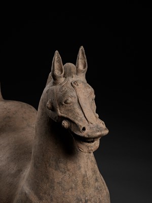 Lot 464 - A VERY LARGE AND MASSIVE SICHUAN POTTERY FIGURE OF A STRIDING HORSE, HAN DYNASTY