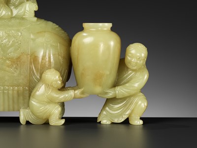 Lot 447 - A YELLOW AND RUSSET JADE ‘ELEPHANT AND BOYS’ GROUP, 18TH CENTURY