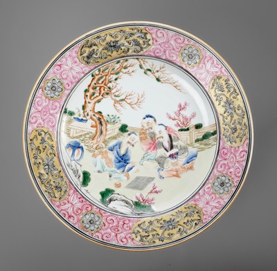 Lot 744 - A GILT, ENAMELED AND GRISAILLE-DECORATED FAMILLE ROSE ‘WEIQI PLAYERS’ DISH, 18TH CENTURY