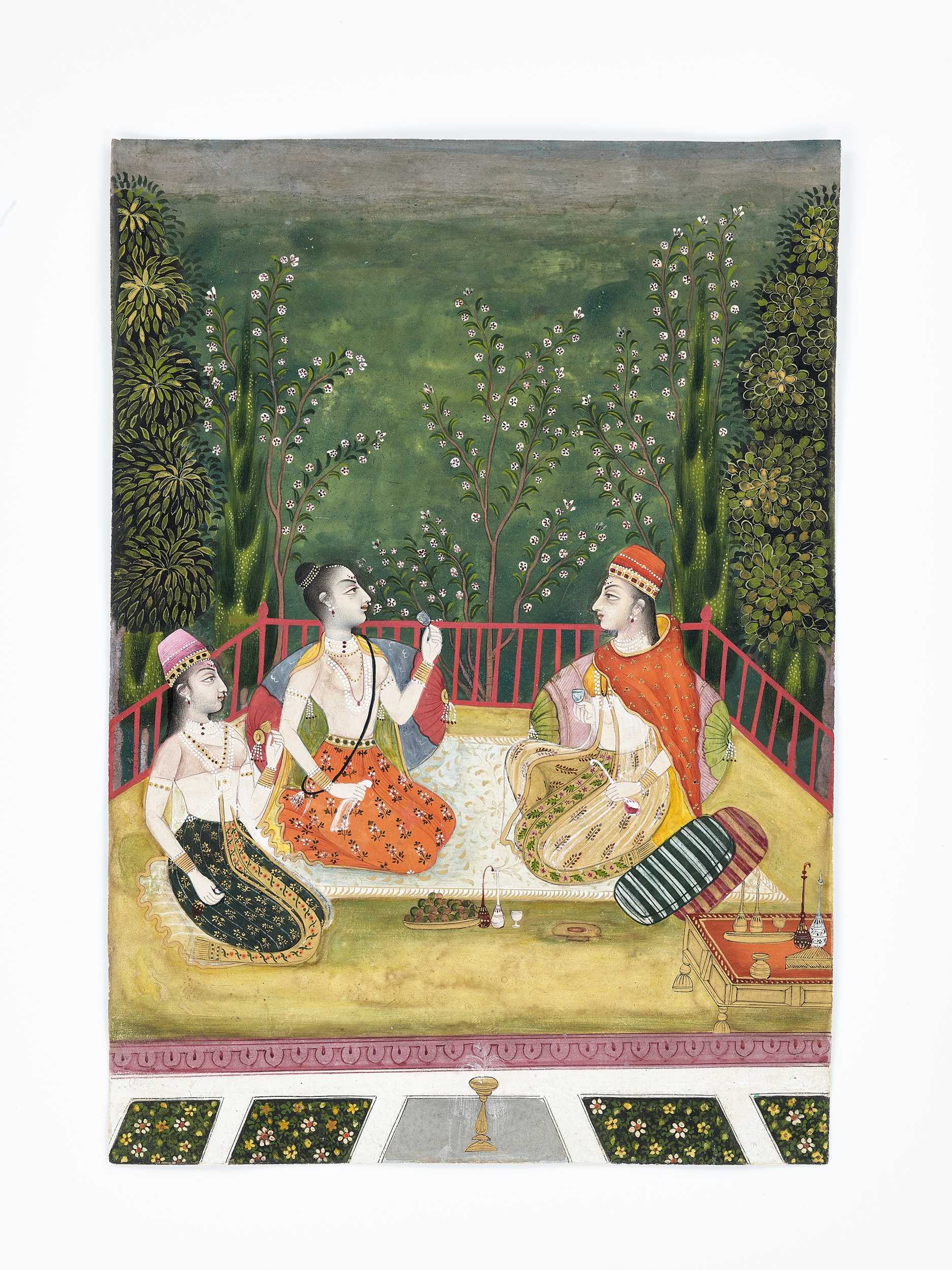 Lot 614 - AN INDIAN MINIATURE PAINTING OF NOBLE LADIES DRINKING WINE IN A GARDEN