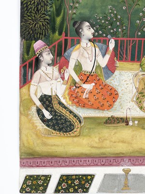Lot 614 - AN INDIAN MINIATURE PAINTING OF NOBLE LADIES DRINKING WINE IN A GARDEN