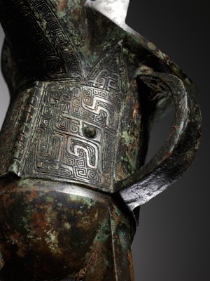 Lot 352 - AN IMPORTANT AND RARE BRONZE RITUAL TRIPOD WINE VESSEL, JUE, SHANG DYNASTY