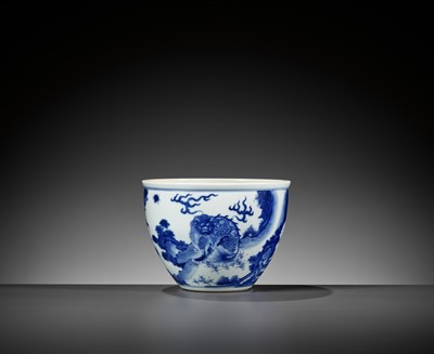 Lot 214 - A BLUE AND WHITE ‘MYTHICAL BEASTS’ JARDINIÈRE, QING DYNASTY