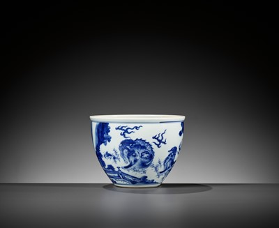 Lot 214 - A BLUE AND WHITE ‘MYTHICAL BEASTS’ JARDINIÈRE, QING DYNASTY