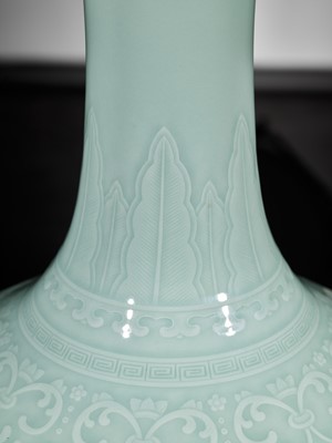 Lot 75 - A CARVED CELADON-GLAZED ‘LOTUS’ VASE, QIANLONG MARK AND PERIOD