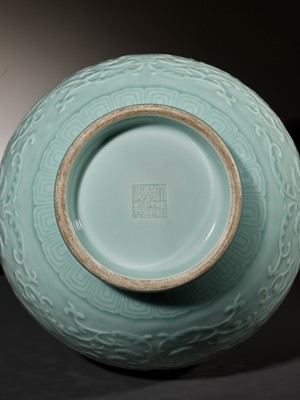 Lot 75 - A CARVED CELADON-GLAZED ‘LOTUS’ VASE, QIANLONG MARK AND PERIOD