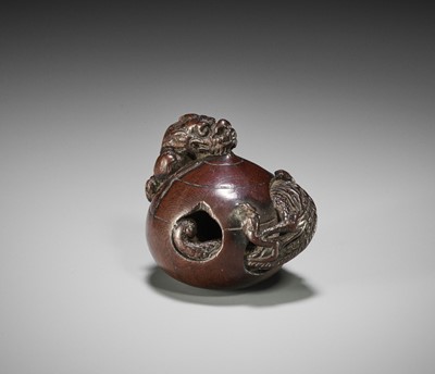 Lot 104 - A RARE WOOD NETSUKE OF A DRAGON EMERGING FROM A TAMA