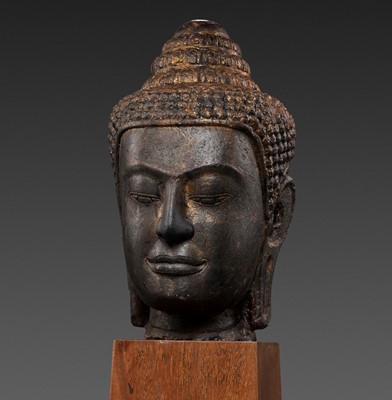 Lot 292 - A LARGE SANDSTONE HEAD OF BUDDHA, POST-ANGKOR PERIOD