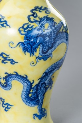 Lot 644 - A BLUE AND YELLOW PORCELAIN ‘DRAGON’ VASE