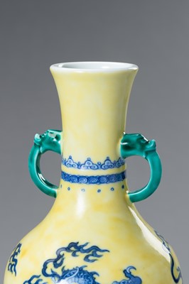 Lot 644 - A BLUE AND YELLOW PORCELAIN ‘DRAGON’ VASE