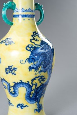 Lot 644 - A BLUE AND YELLOW PORCELAIN ‘DRAGON’ VASE