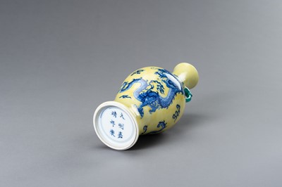 Lot 644 - A BLUE AND YELLOW PORCELAIN ‘DRAGON’ VASE