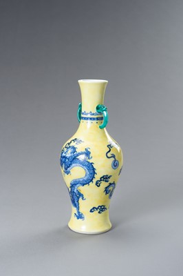 Lot 644 - A BLUE AND YELLOW PORCELAIN ‘DRAGON’ VASE