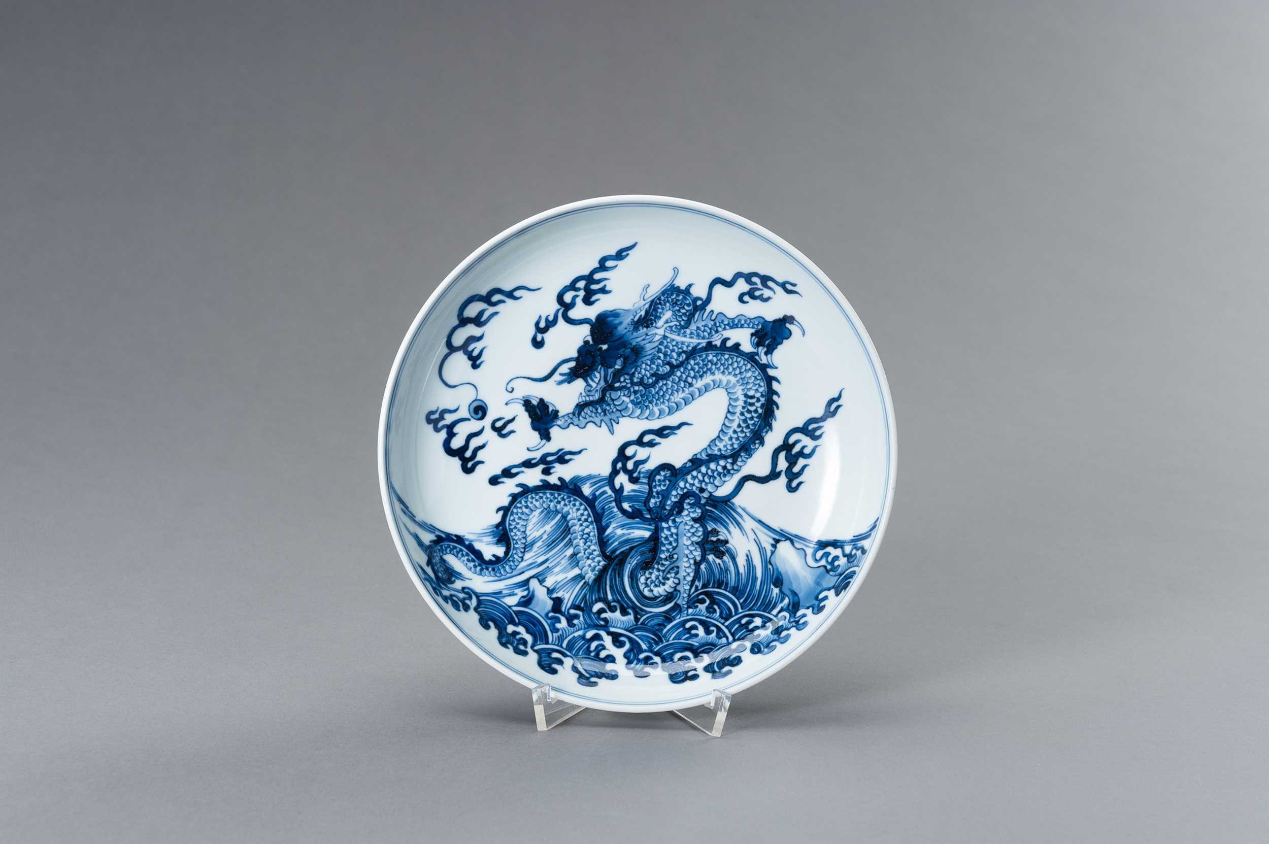 Lot 832 - A BLUE AND WHITE PORCELAIN ‘DRAGON’ PLATE