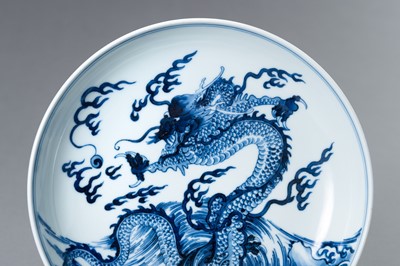 Lot 832 - A BLUE AND WHITE PORCELAIN ‘DRAGON’ PLATE