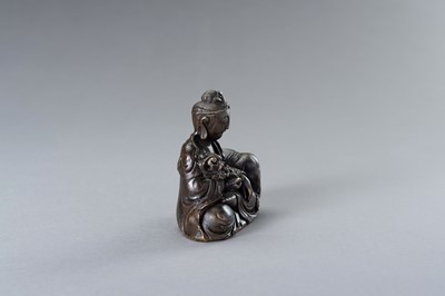 Lot 36 - A BRONZE FIGURE OF GUANYIN WITH ELEPHANT