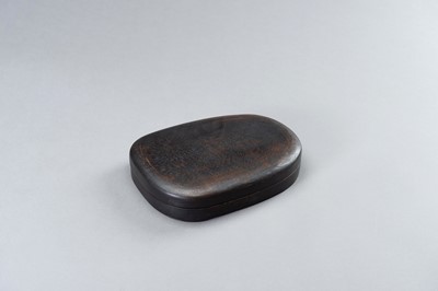 Lot 209 - A CARVED INK STONE WITH A FITTED WOODEN BOX