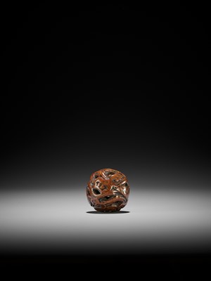 Lot 151 - A WOOD NETSUKE OF A COILED WINGED DRAGON