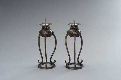 Lot 54 - A PAIR OF BRONZE CANDLE STICK HOLDERS