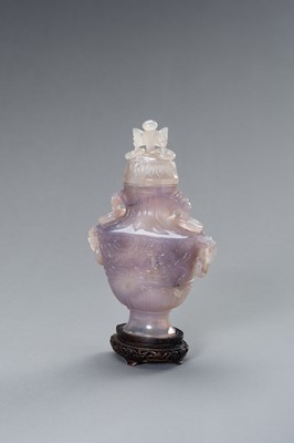 Lot 216 - A LAVENDER HUE CHALCEDONY BALUSTER VASE AND COVER
