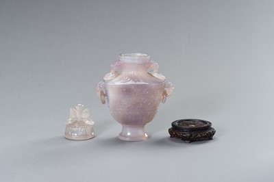 Lot 216 - A LAVENDER HUE CHALCEDONY BALUSTER VASE AND COVER