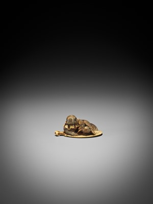 Lot 596 - A STAINED IVORY NETSUKE OF A PUPPY AND A SPARROW