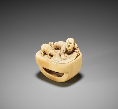 Lot 168 - A CHARMING OLD IVORY NETSUKE WITH A BOY, SCROLL AND DOG