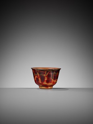 Lot 77 - A SMALL GLASS ‘REALGAR IMITATION’ CUP, 18TH CENTURY