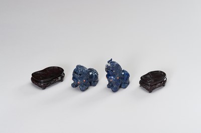 Lot 221 - A PAIR OF LAPIS LAZULI FIGURES OF BUDDHIST LIONS