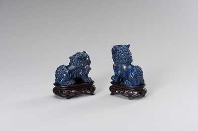 Lot 221 - A PAIR OF LAPIS LAZULI FIGURES OF BUDDHIST LIONS