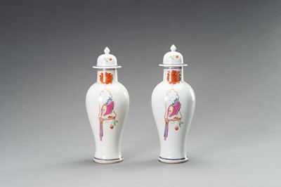A PAIR OF FAMILLE ROSE ‘PARROT ON PERCH’ BALUSTER VASES, QING