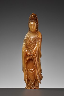 Lot 82 - A CARVED SOAPSTONE FIGURE OF GUANYIN, LATE QING TO REPUBLIC