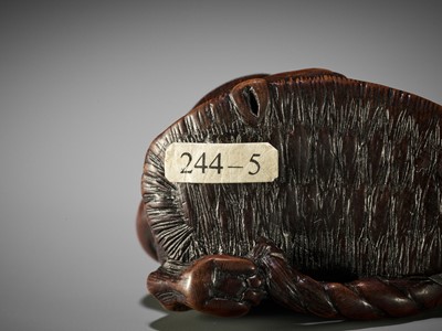 Lot 145 - A WOOD NETSUKE OF A PUPPY PLAYING WITH A SANDAL, ATTRIBUTED TO KOKEI