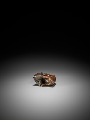 Lot 334 - A RARE LACQUERED NETSUKE OF A MONKEY AND HARE ENGAGED IN KUBIHIKI (NECK WRESTLING)