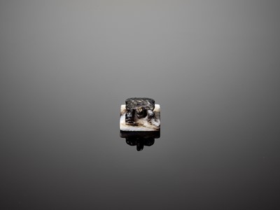Lot 87 - A MINUSCULE WHITE AND BLACK JADE ‘TURTLE’ SEAL, MING DYNASTY
