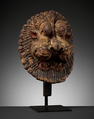 Lot 604 - A LACQUERED WOOD HEAD OF NARASIMHA, 18TH CENTURY