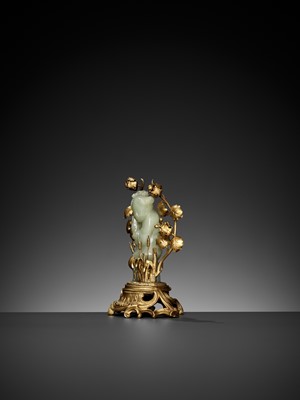 Lot 458 - A CELADON JADE FIGURE OF A BOY MOUNTED ON A GILT BRONZE STAND, QING DYNASTY
