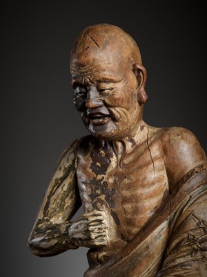 Lot 384 - A PAINTED WOOD AND GESSO FIGURE OF A LUOHAN, MING DYNASTY