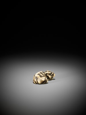 Lot 253 - TOMOTADA: A GOOD STAG ANTLER NETSUKE OF A RECUMBENT COW AND CALF