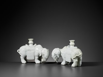 Lot 197 - A DEHUA PAIR OF ELEPHANT CANDLE-HOLDERS, EARLY QING DYNASTY