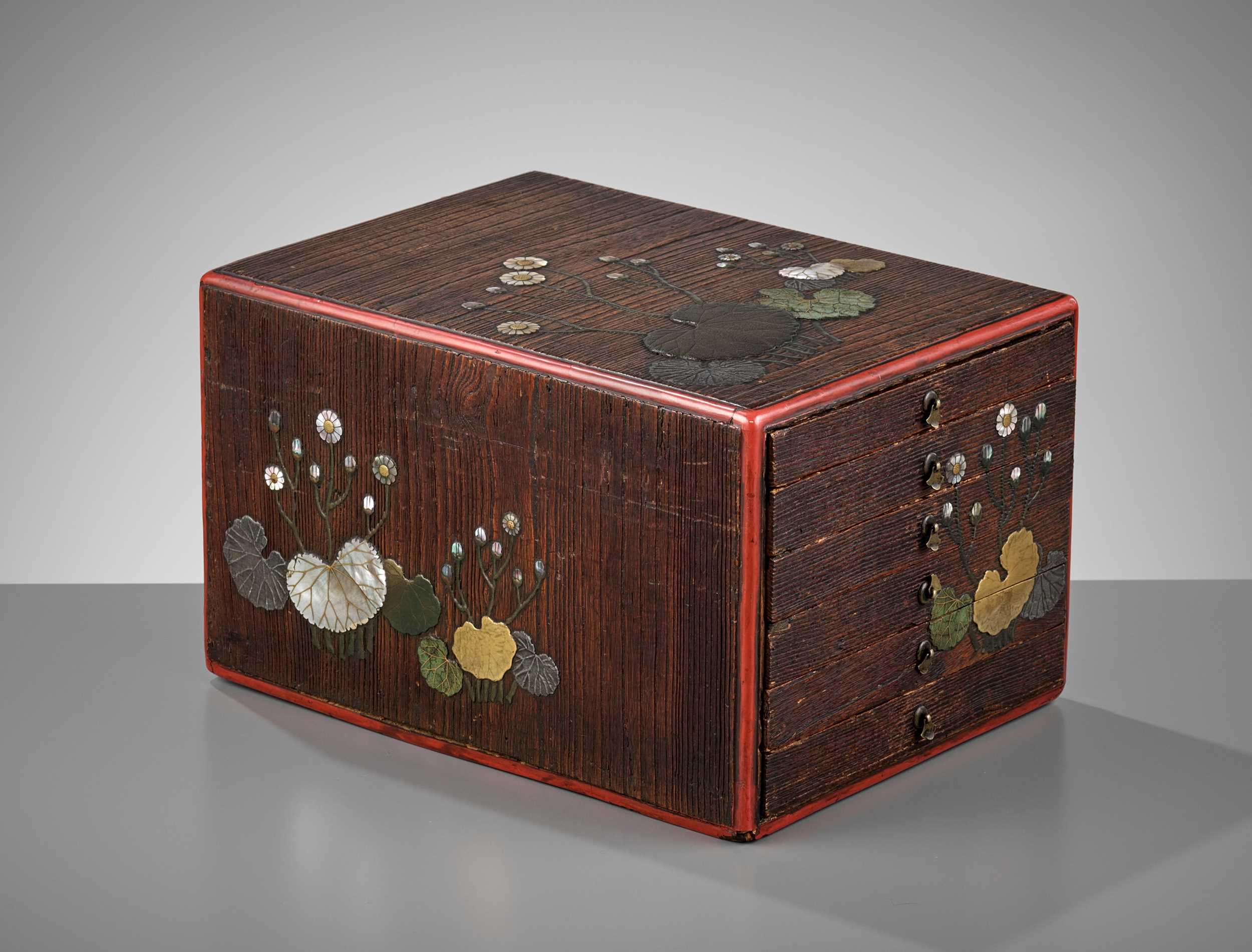 Lot 95 - A CERAMIC AND MOTHER-OF-PEARL INLAID LACQUERED KIRI (PAULOWNIA) WOOD CABINET IN THE STYLE OF RITSUO