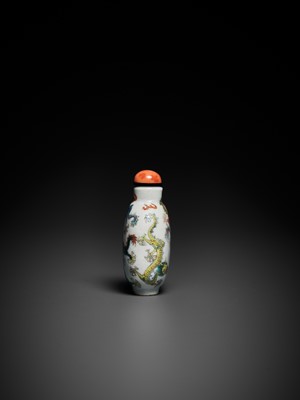 Lot 642 - A MOLDED AND ENAMELED SGRAFFIATO ‘FIVE DRAGON’ PORCELAIN SNUFF BOTTLE, 19TH CENTURY