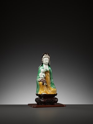 Lot 188 - A BISCUIT PORCELAIN FIGURE OF GUANYIN WITH CHILD, KANGXI PERIOD