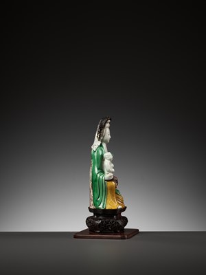Lot 188 - A BISCUIT PORCELAIN FIGURE OF GUANYIN WITH CHILD, KANGXI PERIOD